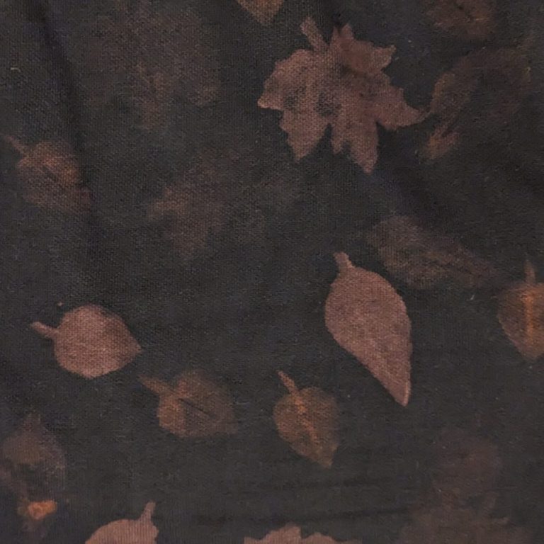 Art and Wellbeing Workshop Photo of two tables filled with art supplies, and surrounded by people making their own artwork